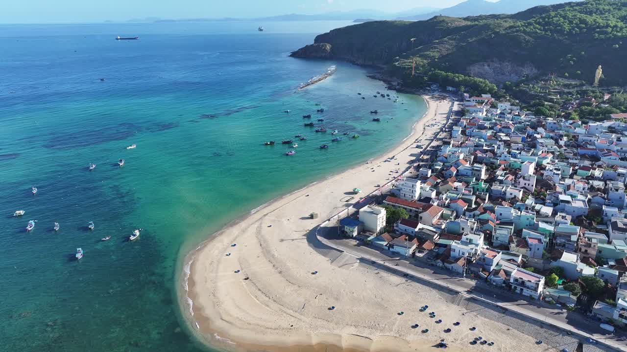 Aerial View of a Coastal Village and Beach