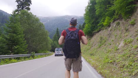 hitchhiking on empty road.