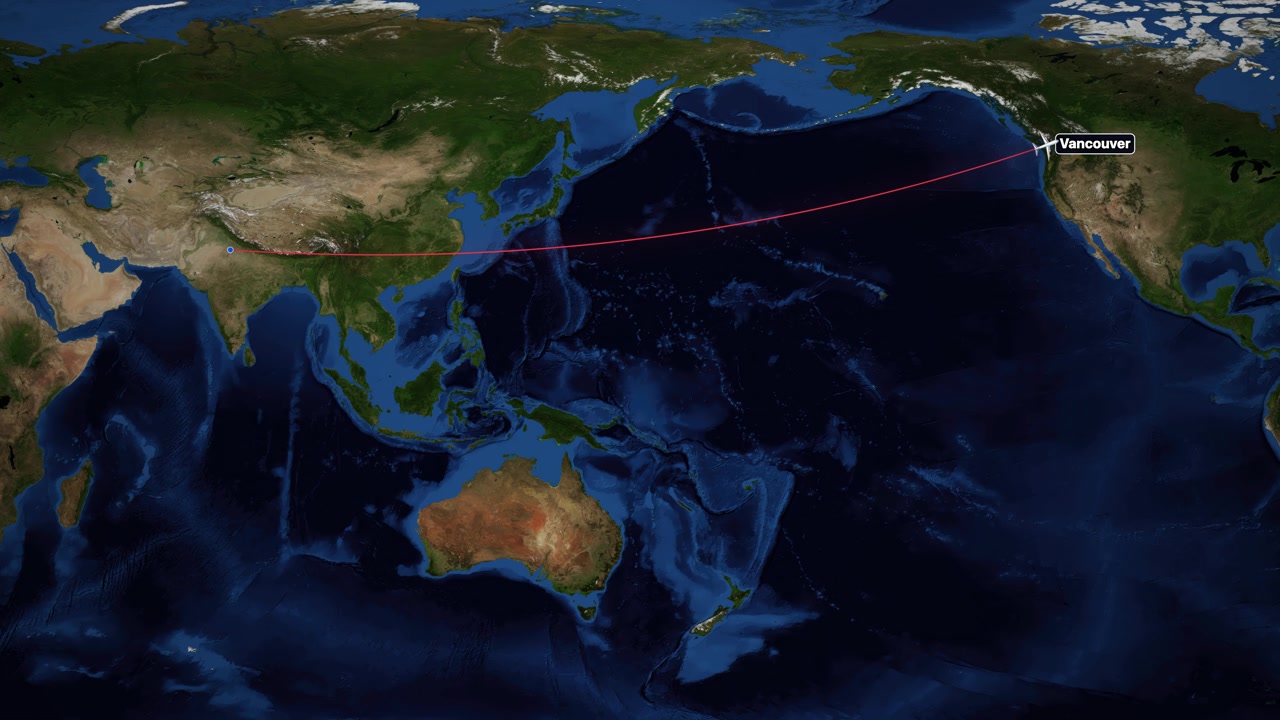 Animated airplane icon follows a red flight path from India to Canada on world map.