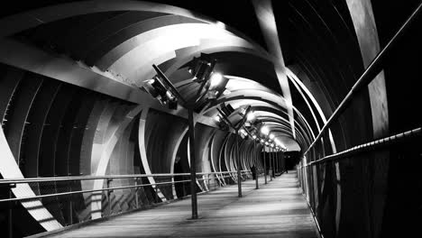 a pedestrian tunnel filmed in black and white