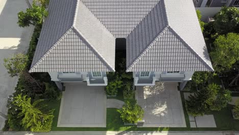 aerial footage of white and gray modern comtemporary house