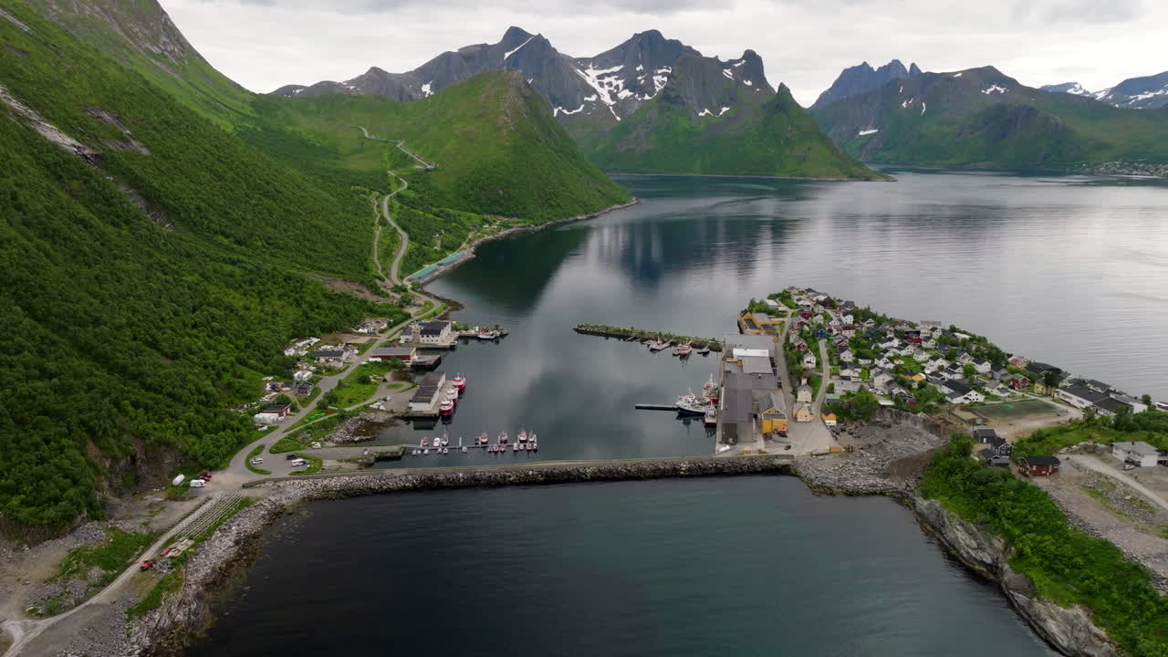 Aerial View Of Husoy, Small Fishing Village On An Islet Off The Coast Of Senja Island In Northern Norway