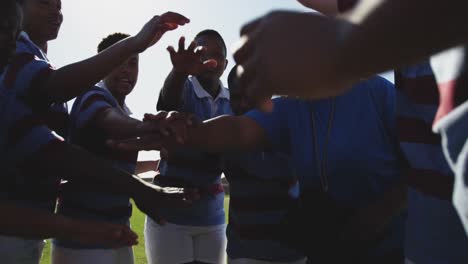 Young-adult-female-rugby-team-and-coach