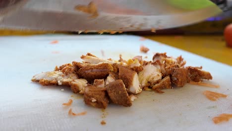 chopping diced chicken