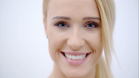 close up smiling face of pretty blond female