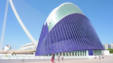 visitors walk outside the caixaforum valencia, agora, in the city of arts and sciences. designed by santiago calatrava, it is the most significant modern tourist destination in valencia.