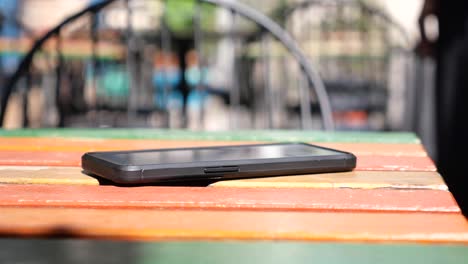 cellphone on a wooden table