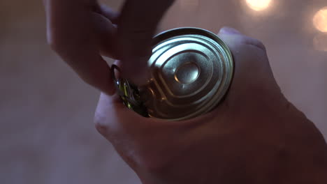 opening a metal can, gravy pours out