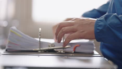 close up of an officer looks for document in the drawer