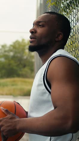 man waiting for the basketball game