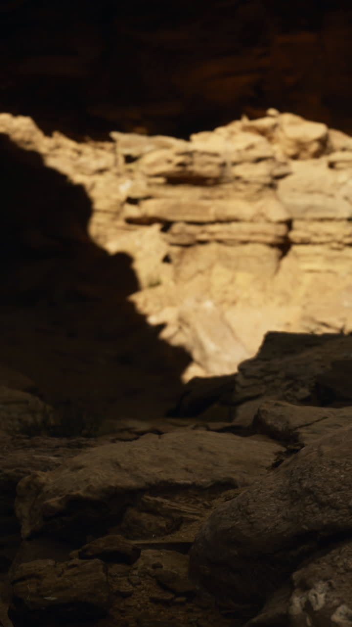 Exploring a rocky canyon with natural light illuminating the formations