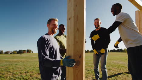 men collaborating on outdoor wooden structure construction