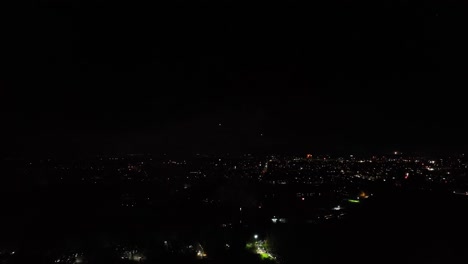 Aerial-shot-of-colourful-small-fireworks-going-off-at-a-display-during-guy-Fawkes-night