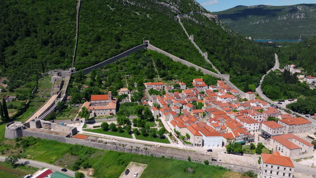 The Fortified Walls Of The City Ston In Croatia - Aerial Shot