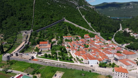 the fortified walls of the city ston in croatia - aerial shot