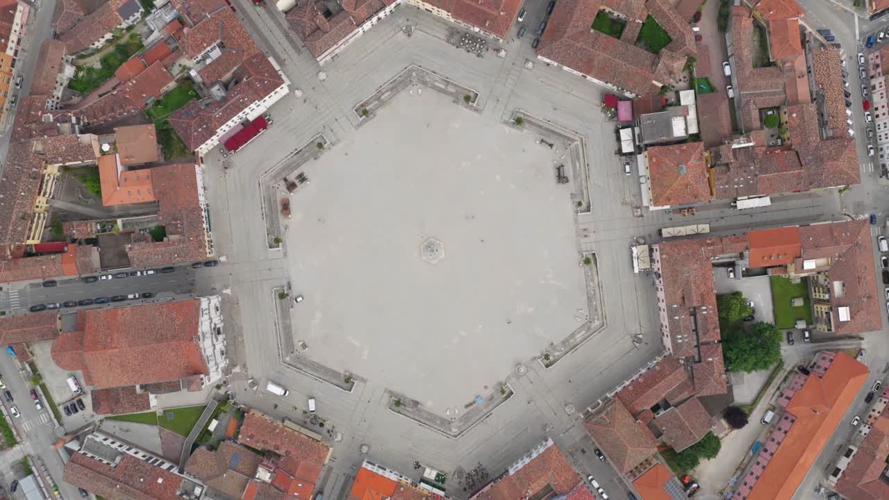 Rotated top-down view of radial symmetry with streets converging toward the center