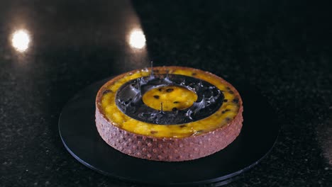 close-up of chef is making dessert with passion fruit