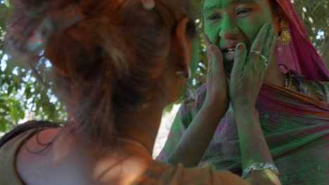 multi ethnic people celebrating the festival of colors holi in india