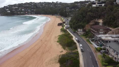 Drone-descending-on-a-beautiful-sandy-beach