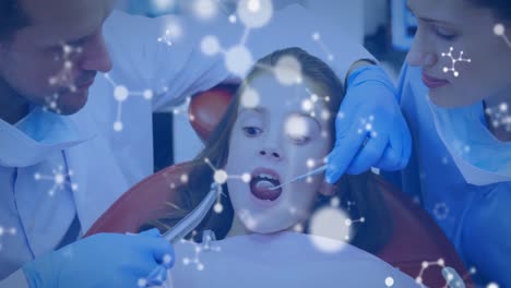 Glowing-molecular-structures-moving-against-dentists-treating-female-patients