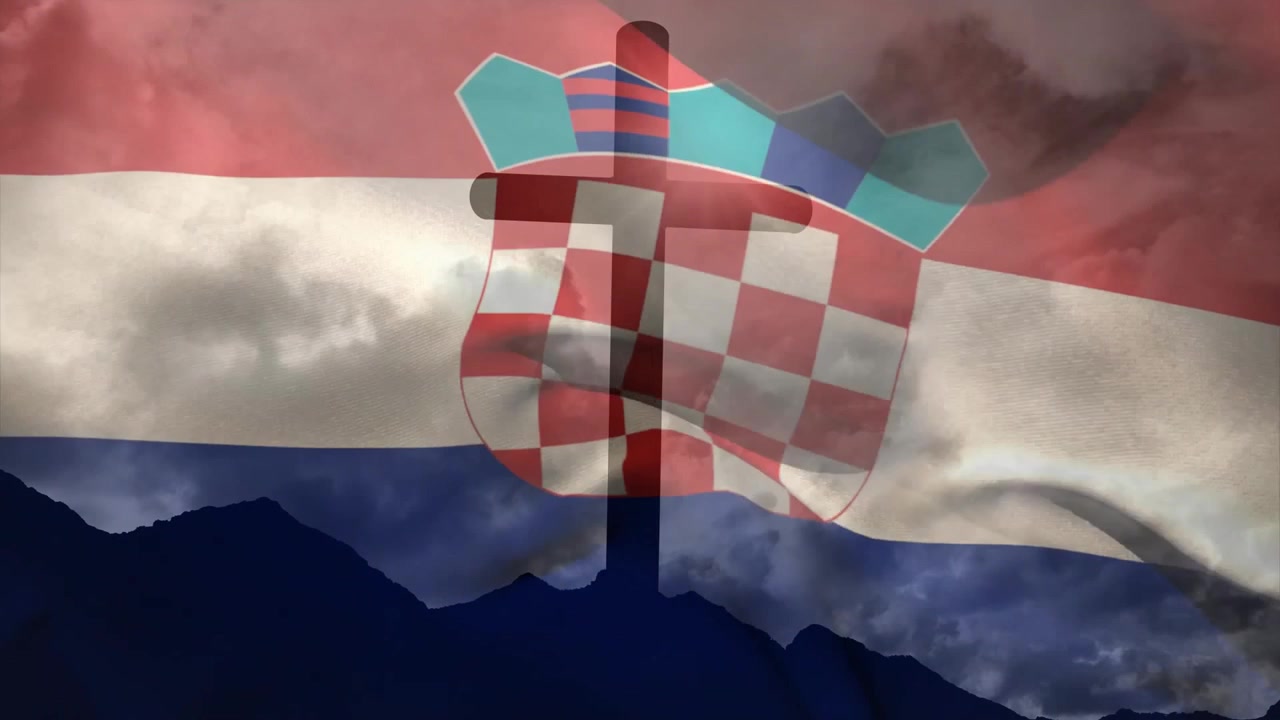 Bryza inicjuje ruch flagi, krzyż pozostaje nieruchomy, podczas gdy flaga chorwacka faluje, przywołując dziedzictwo.