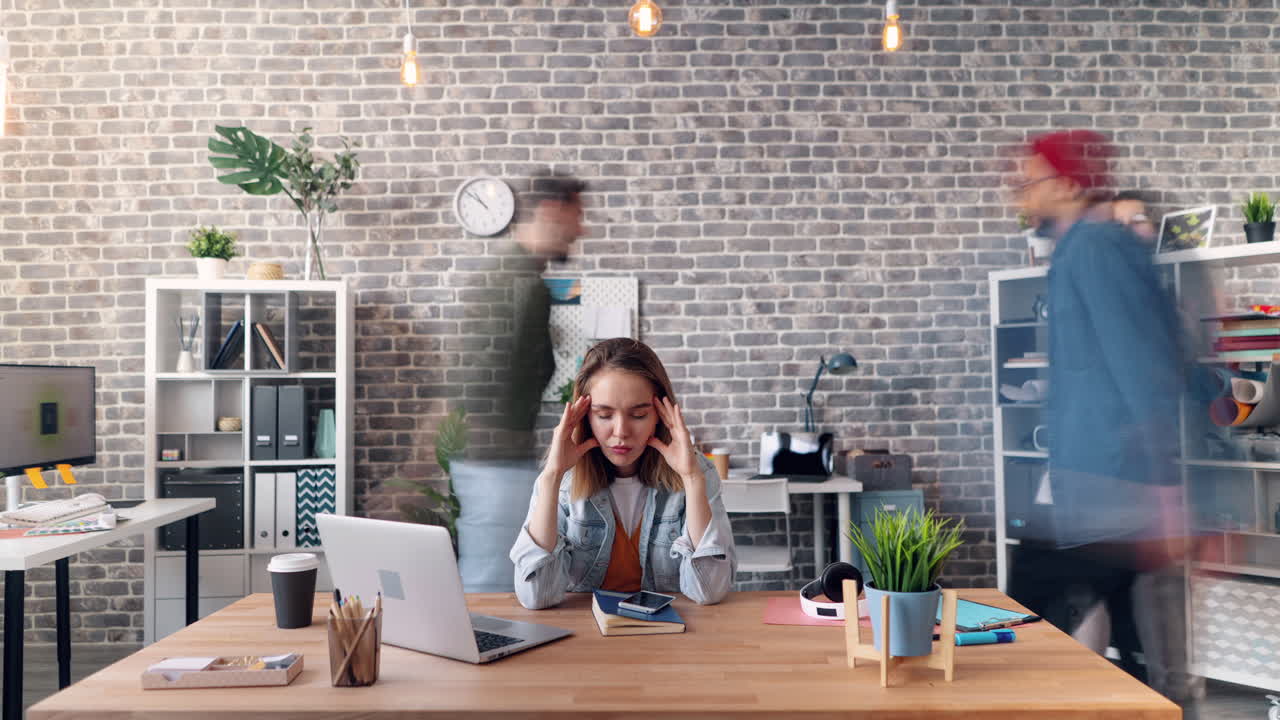 Overwhelmed Woman in Busy Office