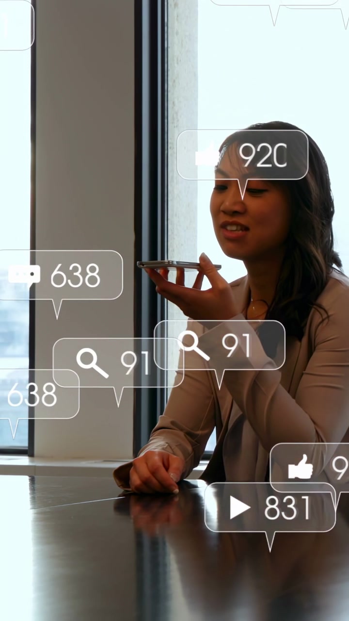 Vertical video: Woman raising phone and posting marketing update, badges drifting and clustering