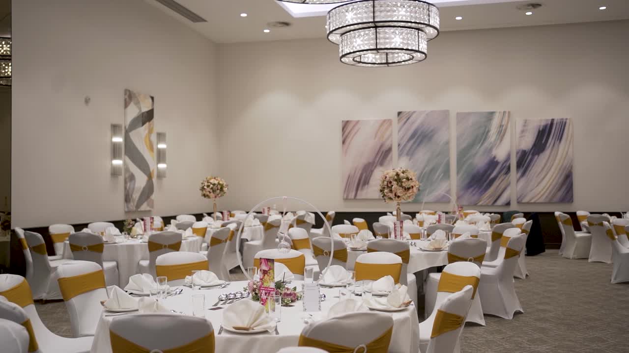 The dining area at a traditional wedding, adorned with a magnificent theme, is captured in an incredible shot.