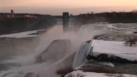 niagara falls in winter from the top looking toward the closest bridge