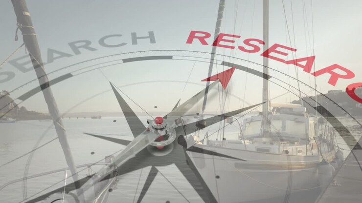 Compass pointing to RESEARCH animation over sailboats docked at marina