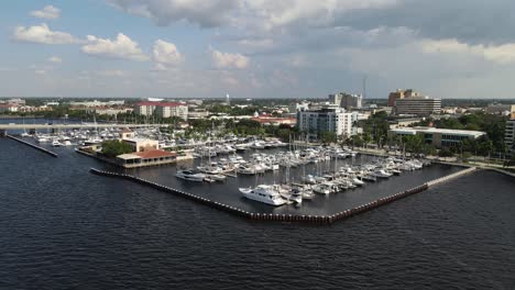 aerial view of bradenton marina with boats docked and the city skyline over the manatee river