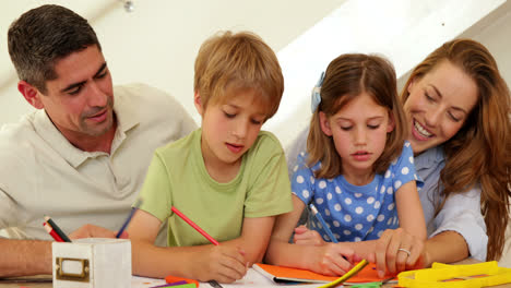 Happy-parents-and-children-colouring-together