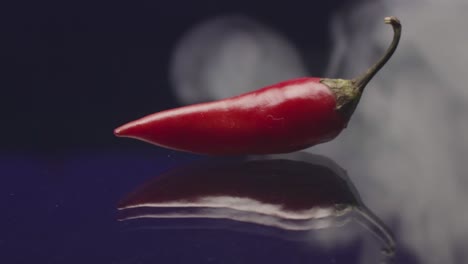 red chili pepper in smoke