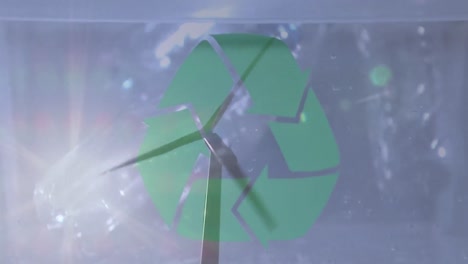 Animation-of-green-recycling-sign-over-box-with-plastic-boxes-and-wind-turbine