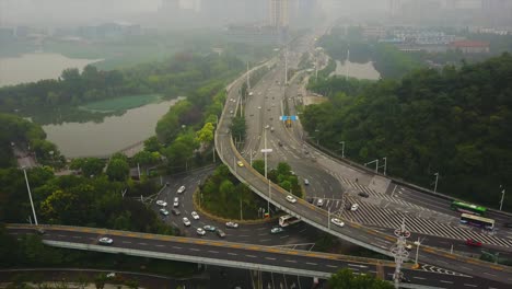 day time wuhan cityscape traffic road junction aerial lake panorama 4k china