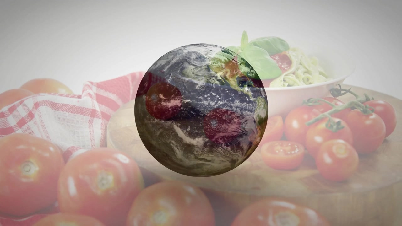 Globo 3D che appare e ruota verso est mostrando la luce del giorno su pomodori e insalata sfocati.