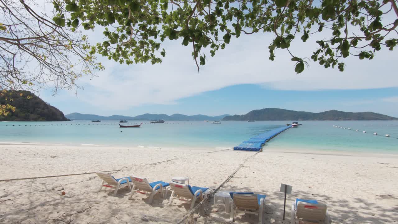 Empty chairs under a shadow of tree