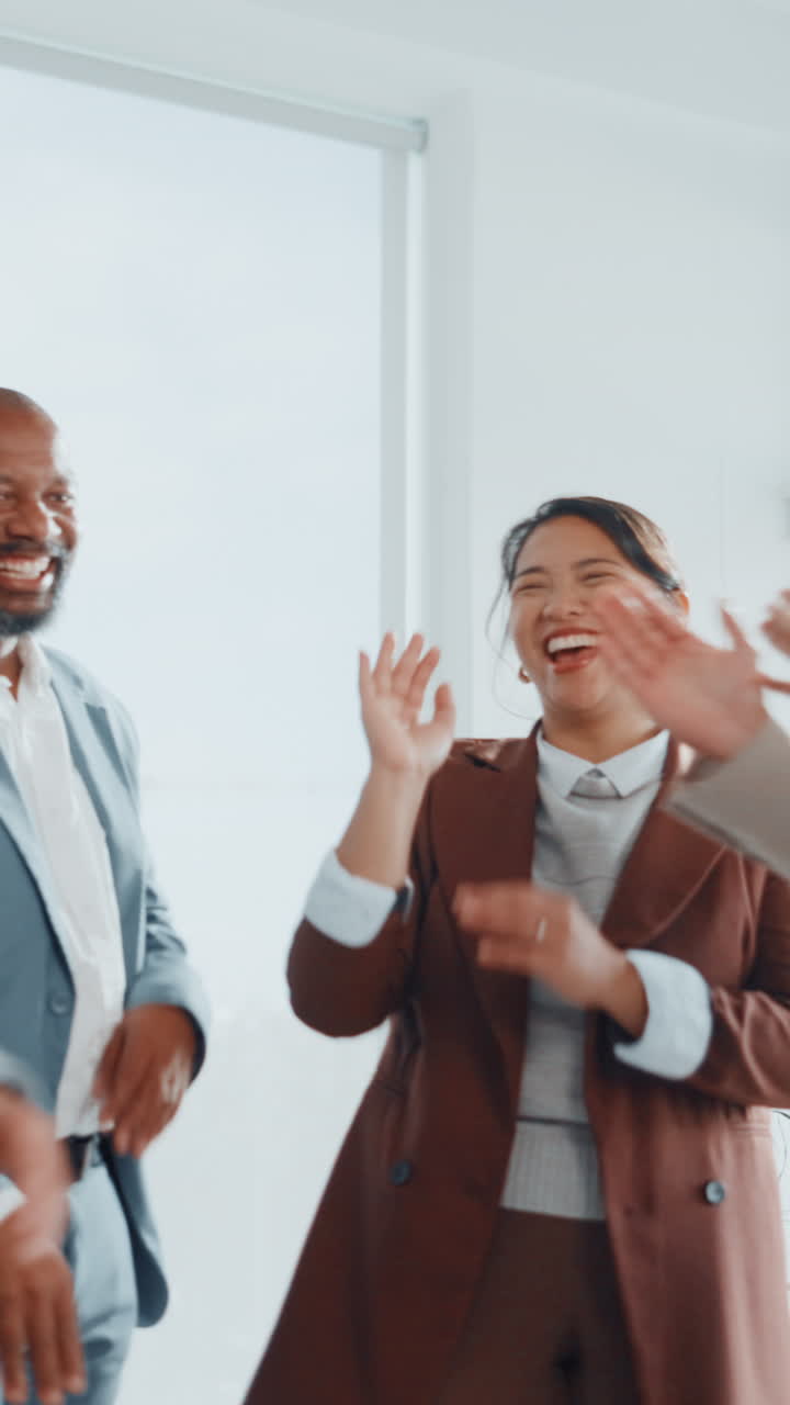 Diverse Business Team Celebrating Success with High Fives and Clapping