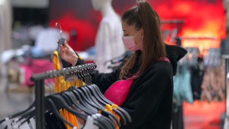 woman shopping for clothes in a retail store