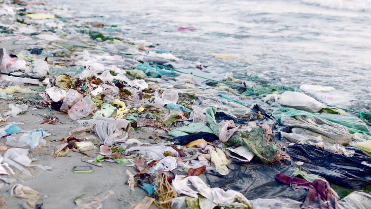 Excess plastic waste washed up on the shore line ina Vietnamese fishing village, Asia.