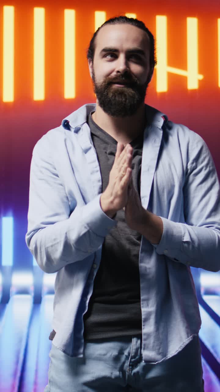 Vertical Video Trendy young person posing in neon lit futuristic environment