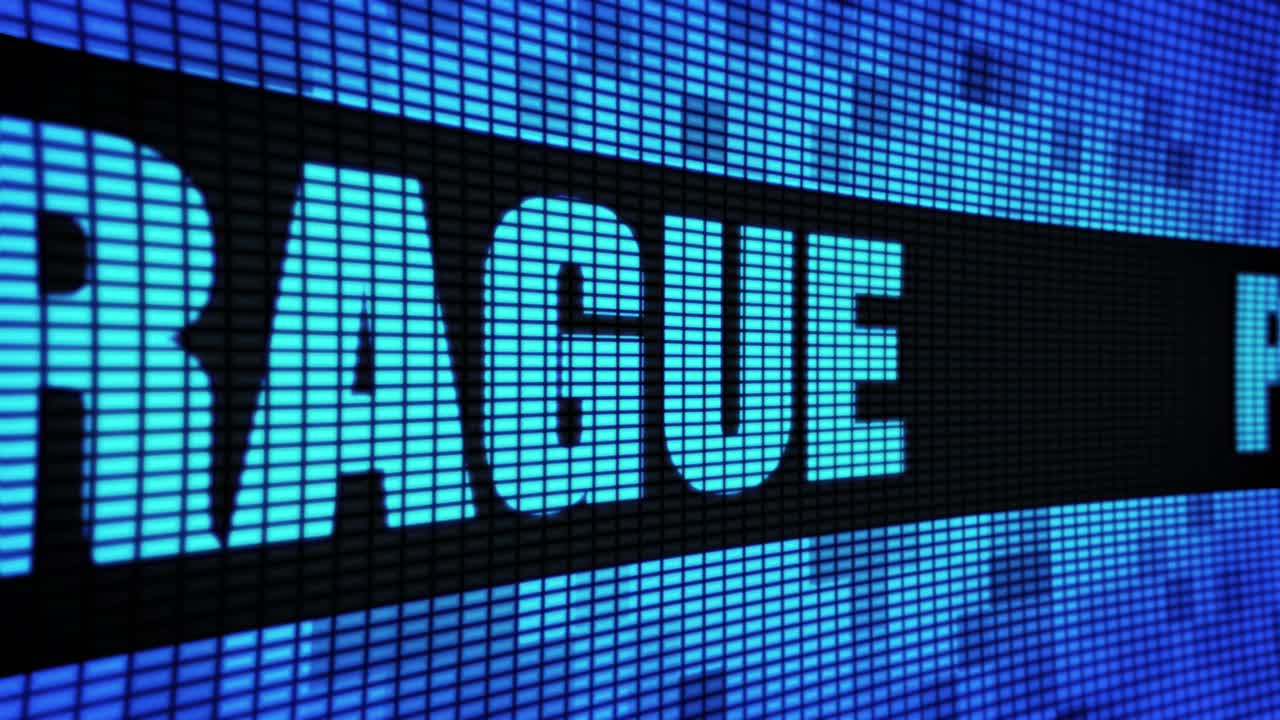 Digital display showing text "DUE PRAGUE" and "ACUTE PR" 