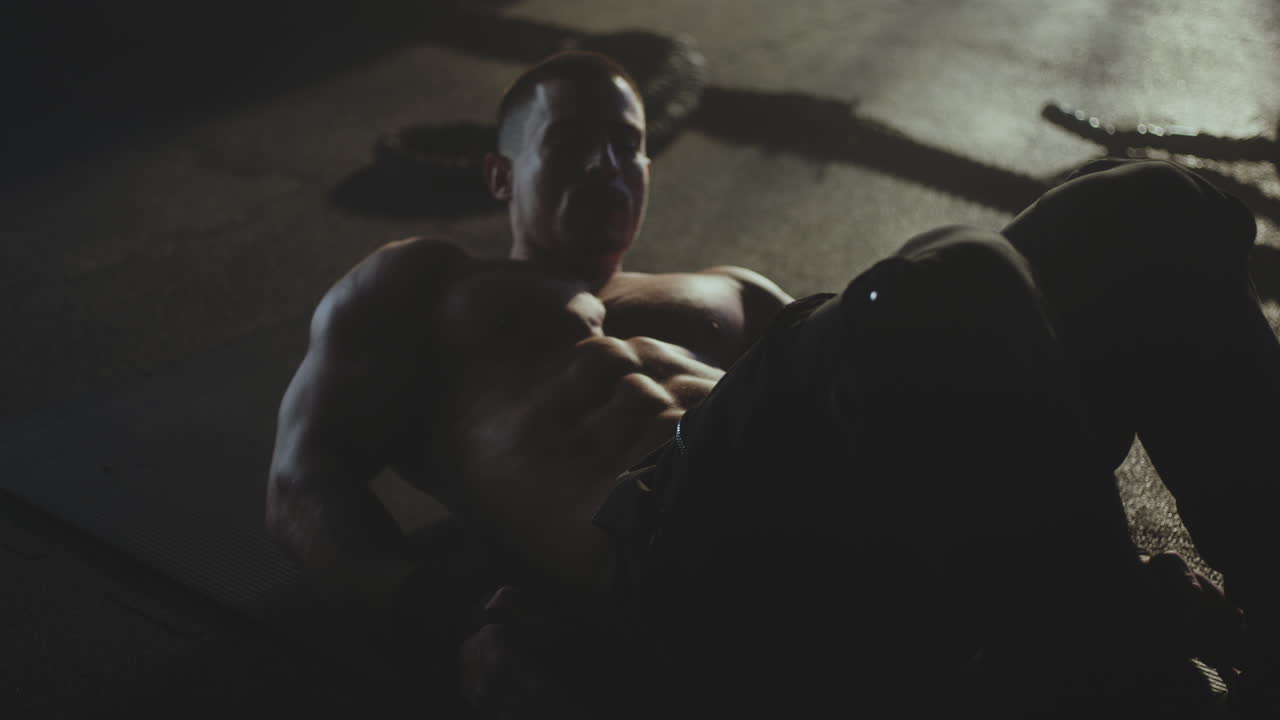 Man doing sit-ups in gym