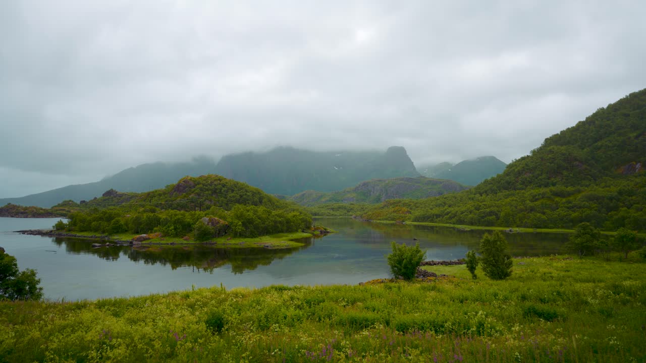 Mystical fjord at Lofoten Island with mountains and clouds. Norway, Scandinavia. Scenic landscape nature
