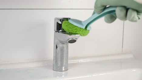 cleaning a bathroom faucet