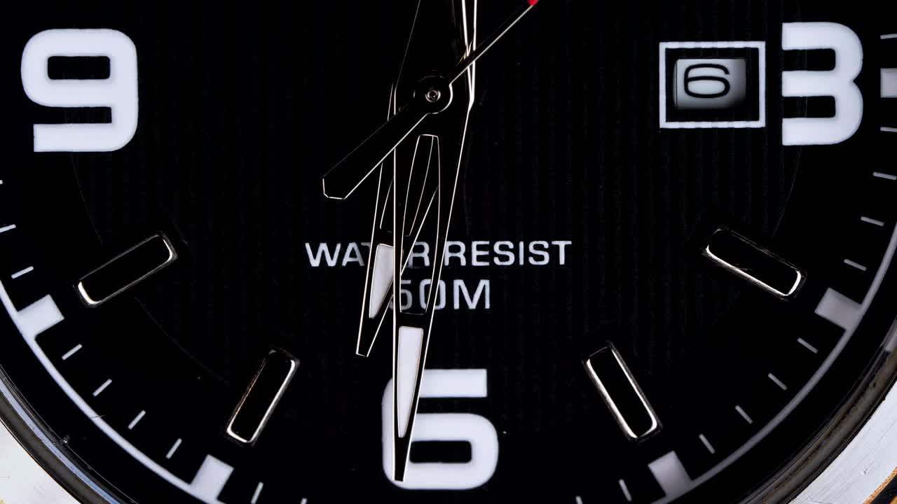 The movement of the hands of a wristwatch.