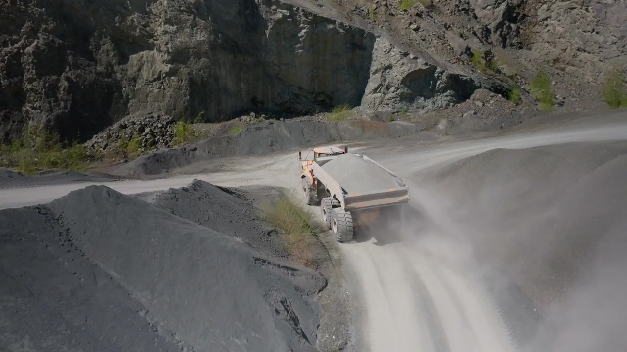 Industrial Sites, Aggregates Excavation, Haulage Truck Journeys, Quarry Stockpiles, Aerial Tracking View