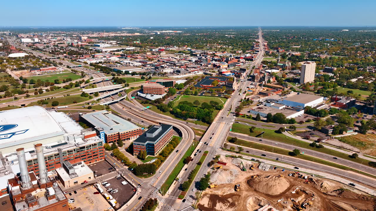 Detroit, USA, 28 July 2025: Uptown of modern Detroit, Michigan, USA with lively roads. Green city scenery with prevailing low-rise architecture from drone footage