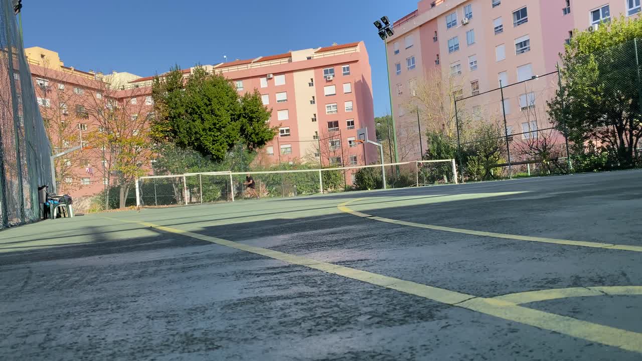 Professional tennis player hitting forehands and gets disappointed after losing a rally in match in Lisbon