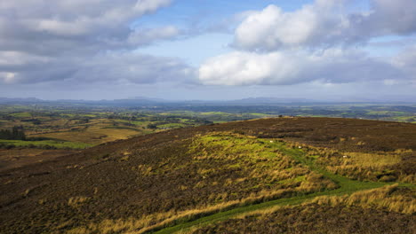 Timelapse-of-rural-nature-farmland-with-hills-in-distance-during-sunny-day-with-clouds-in-the-sky-viewed-from-Carrowkeel-in-county-Sligo-in-Ireland